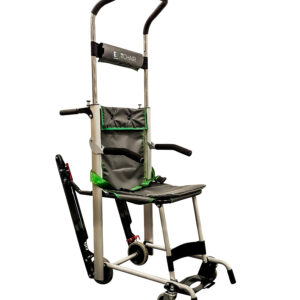 The Exitmaster Versa Elite Evacuation Chair, showcasing its premium green seat, black frame, four wheels, distinct top handle, and visible padded armrests and four-point safety harness.