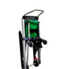 The Exitmaster Versa Evacuation Chair, an upright chair with a green seat, grey frame, and distinctive top handle, ready for emergency use.