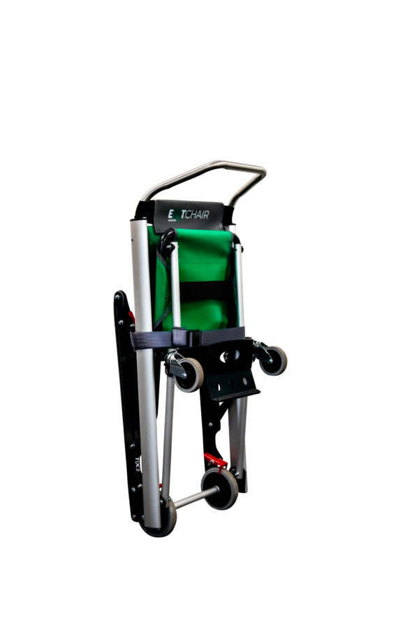 The Exitmaster Versa Evacuation Chair, an upright chair with a green seat, grey frame, and distinctive top handle, ready for emergency use.